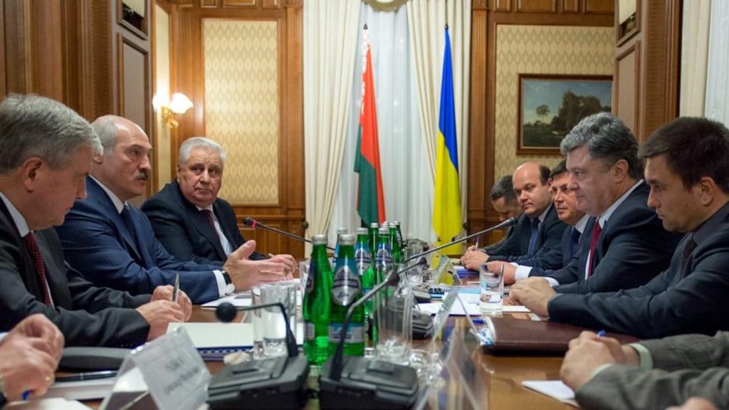 Members of the Ukrainian delegation (left) and members of a Belarussian delegation during talks in Kiev, Ukraine. Photograph: Mykola Lazarenko/EPA