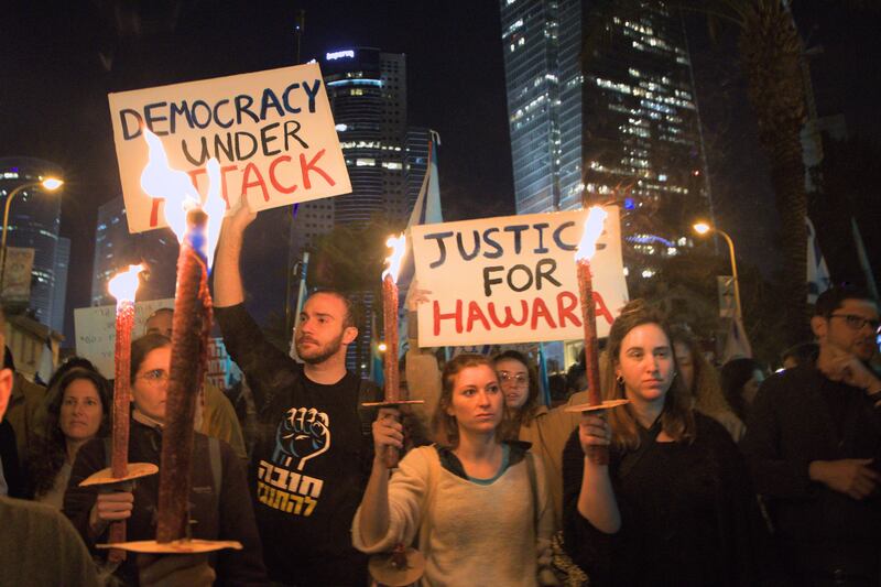 Some protestors in Tel Aviv have begun holding posters asking for justice for Huwara after the violent attack on the town on February 26th. Photograph: Hannah McCarthy