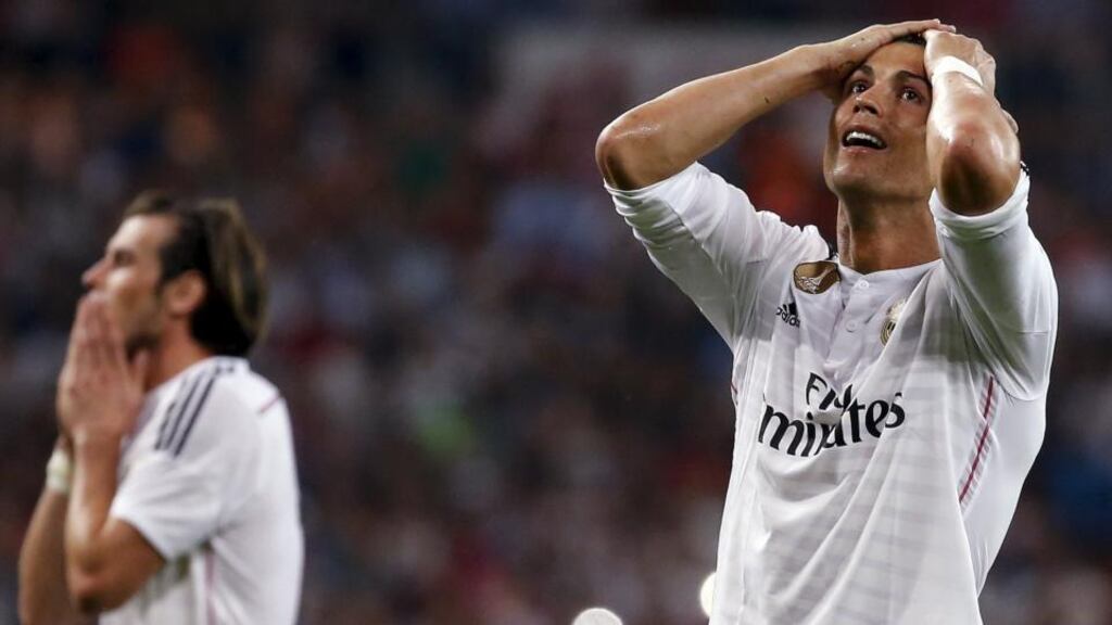 Real Madrid’s Cristiano Ronaldo reacts after missing a chance to score against Valencia. Photograph: Paul Hanna