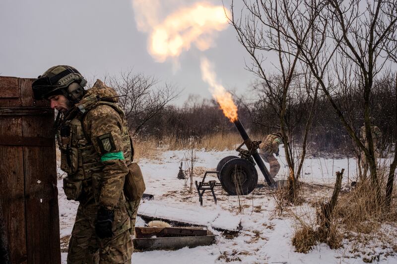 Ukrainian servicemen target Russian forces near Bakhmut. Photograph: Daniel Berehulak/New York Times