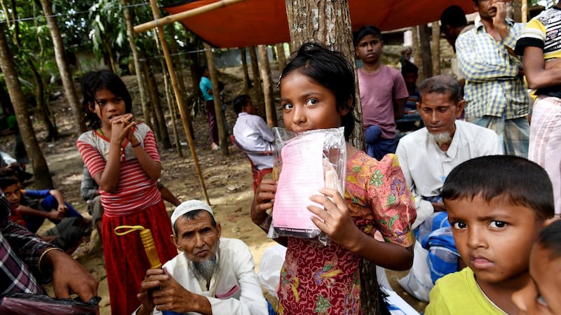 Rohingya children wait for their parents to receive aid at the Balukhali food distribution centre near Cox’s Bazar in Bangladesh on December 19th. 2017. Photograph: Tracey Nearmy/EPA