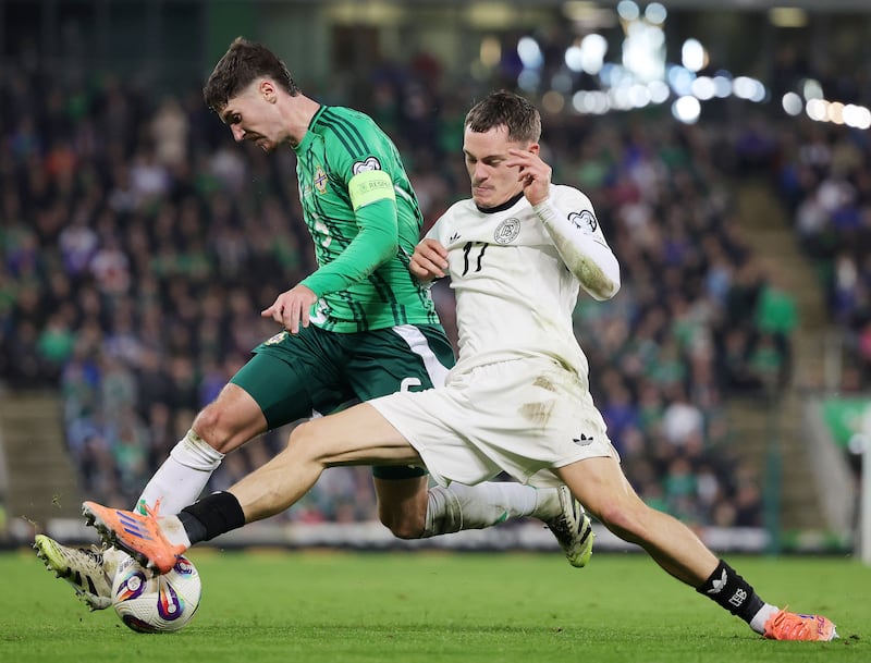Northern Ireland’s Trai Hume and Germany’s Florian Wirtz. Photograph: Jonathan Porter/Presseye/Inpho