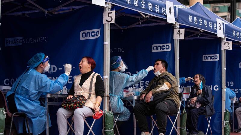 People are tested for Covid-19 at a temporary testing site in Hong Kong. Photograph: Louise Delmotte/AFP via Getty Images