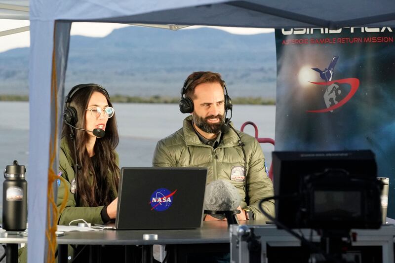 Nasa team members broadcast a live feed of the Osiris-Rex asteroid sample return and recovery mission at Dugway, Utahon Sunday. Photograph: George Frey/Getty Images