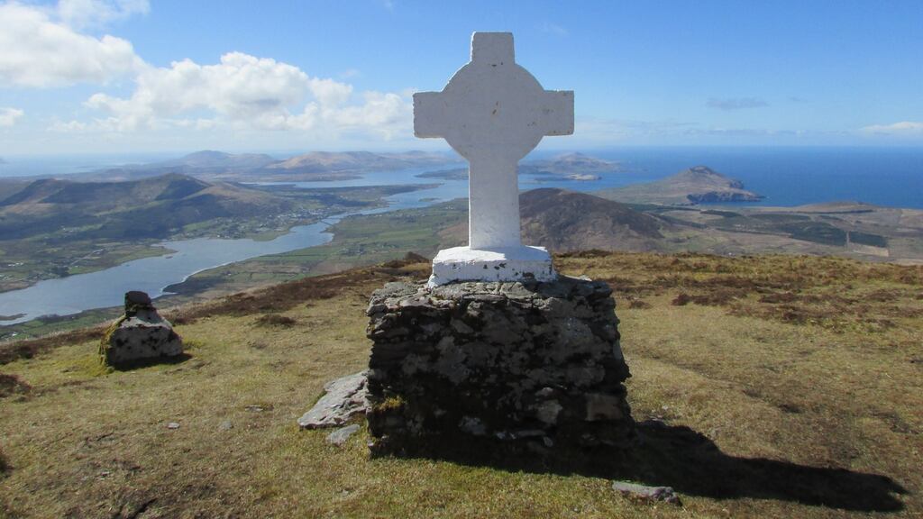 Cnoc na dTobar mountain towers above Cahersiveen, and has been a sacred site since the pagan Lúghnasa festival was celebrated on its summit
