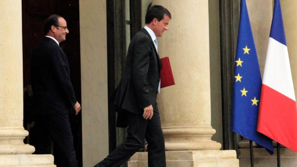 French president Francois Hollande watches as prime minister Manuel Valls leaves after their meeting at the Elysee Palace in Paris yesterday. Photograph: John Schults/Reuters
