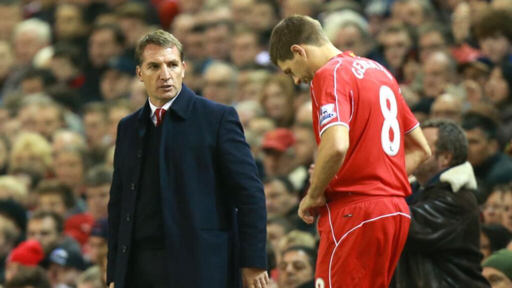 Liverpool manager Brendan Rodgers looks on as Steven Gerrard gets ready to be substituted onto the pitch during the Premier League against Stoke City at Anfield. Photograph: Peter Byrne/PA