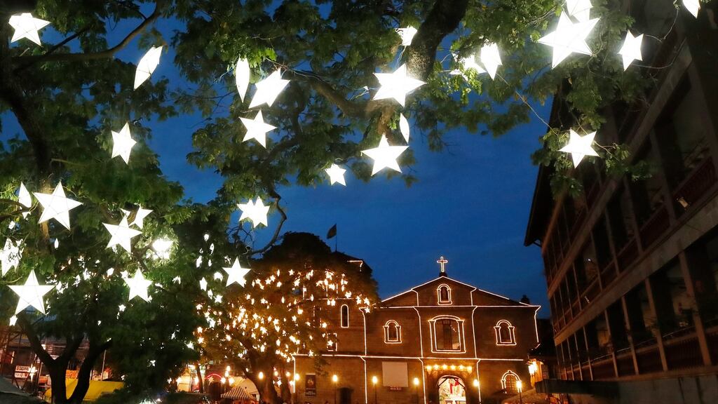 Catholics attending a dawn Mass in Las Pinas City in the Philippines on Wednesday. The leaders of the Catholic Church and Church of Ireland have issued a joint Christmas message lamenting two of the worst years ever because of the pandemic. Photograph: Francis R Malasig/EPA