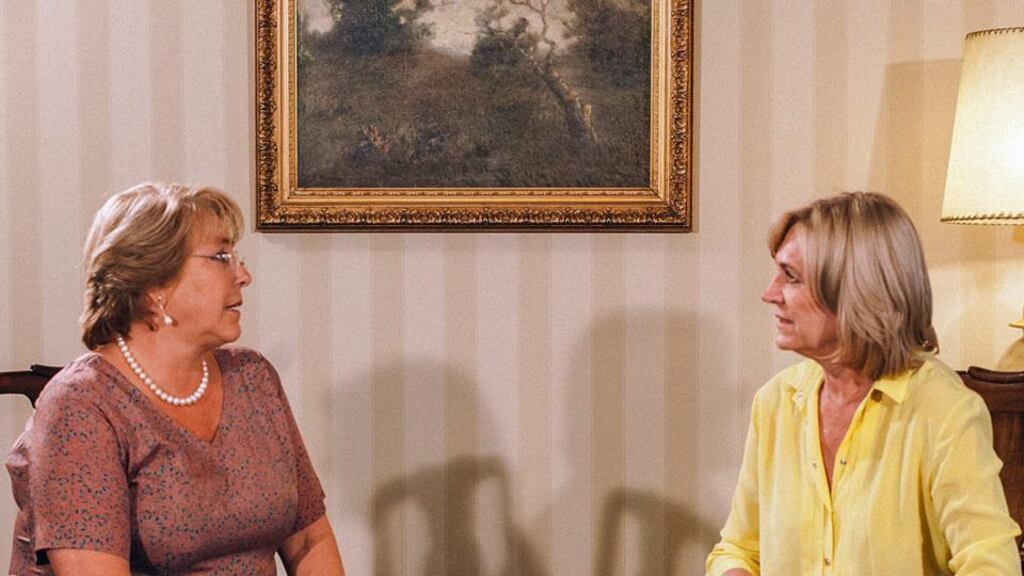 Chilean president-elected Michelle Bachelet (L) meeting with candidate of La Alianza, Evelyn Matthei (R) in Santiago, Chile yesterday. Photograph: EPA.