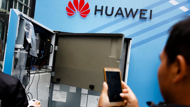 Huawei workers have been accused of bribing government officials to win business in Africa, copying an US competitor’s source code and even stealing the fingertip of a robot in a T-Mobile lab. Photograph: Reuters