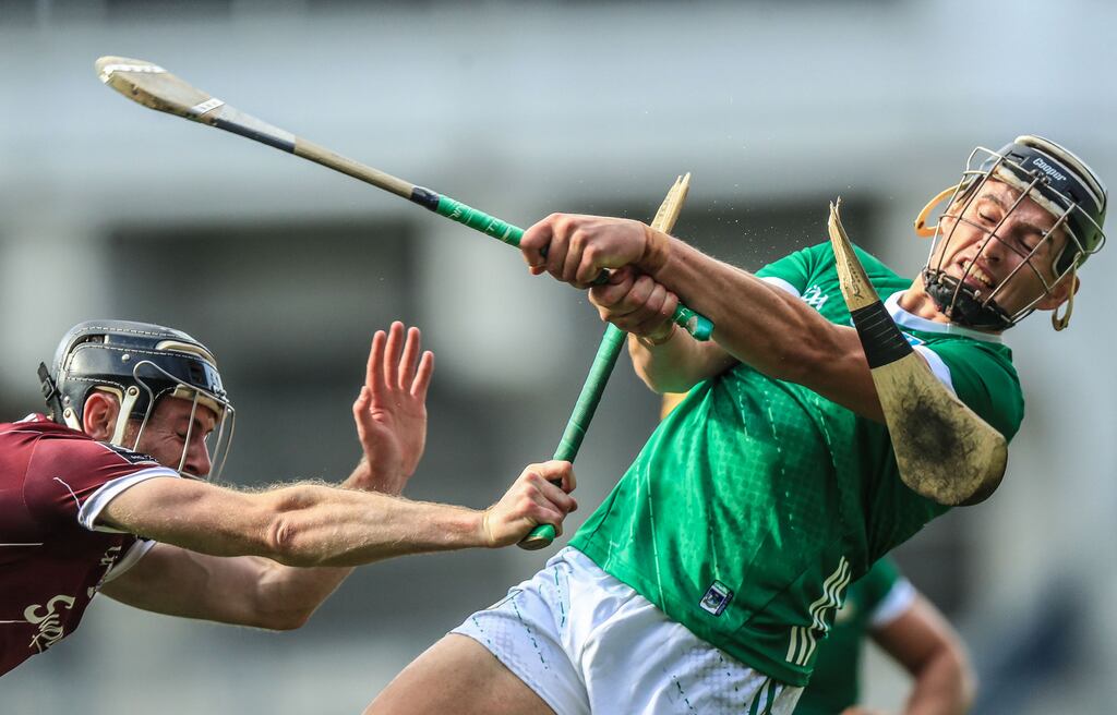 Limerick's Gearoid Hegarty tries to get his shot away despite the challenge from Padraic Mannion of Galway. Photograph: Evan Treacy/Inpho
