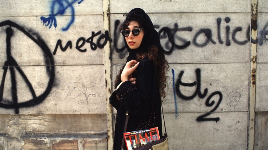 "Trendy young women wear the headscarf as far back on their head as they dare, and apply heavy make-up. At the sight of police, women scramble to push the headscarves forward". Photograph: Getty Images