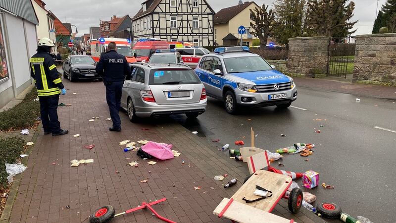 A broken handcart is seen in front of emergency services vehicles in Volkmarsen near Kassel, central Germany. Photograph: Elmar Schulten/AFP via Getty