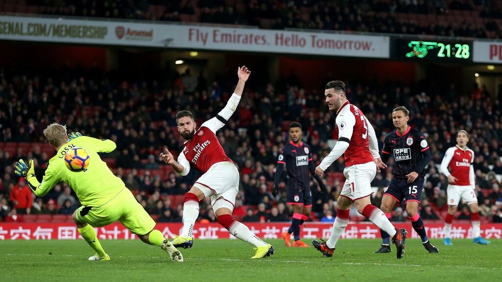 Arsenal’s Olivier Giroud scores his side’s fifth goal of the game during their Premier League win over Huddersfield Town. Photo: Nigel French/PA