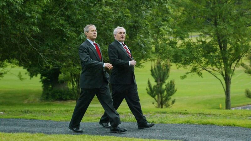 Former US president George W Bush with Bertie Ahern as they go for a stroll around the grounds of Dromoland Castle in Co Clare in 2004. File photograph: PA/Maxwell’s
