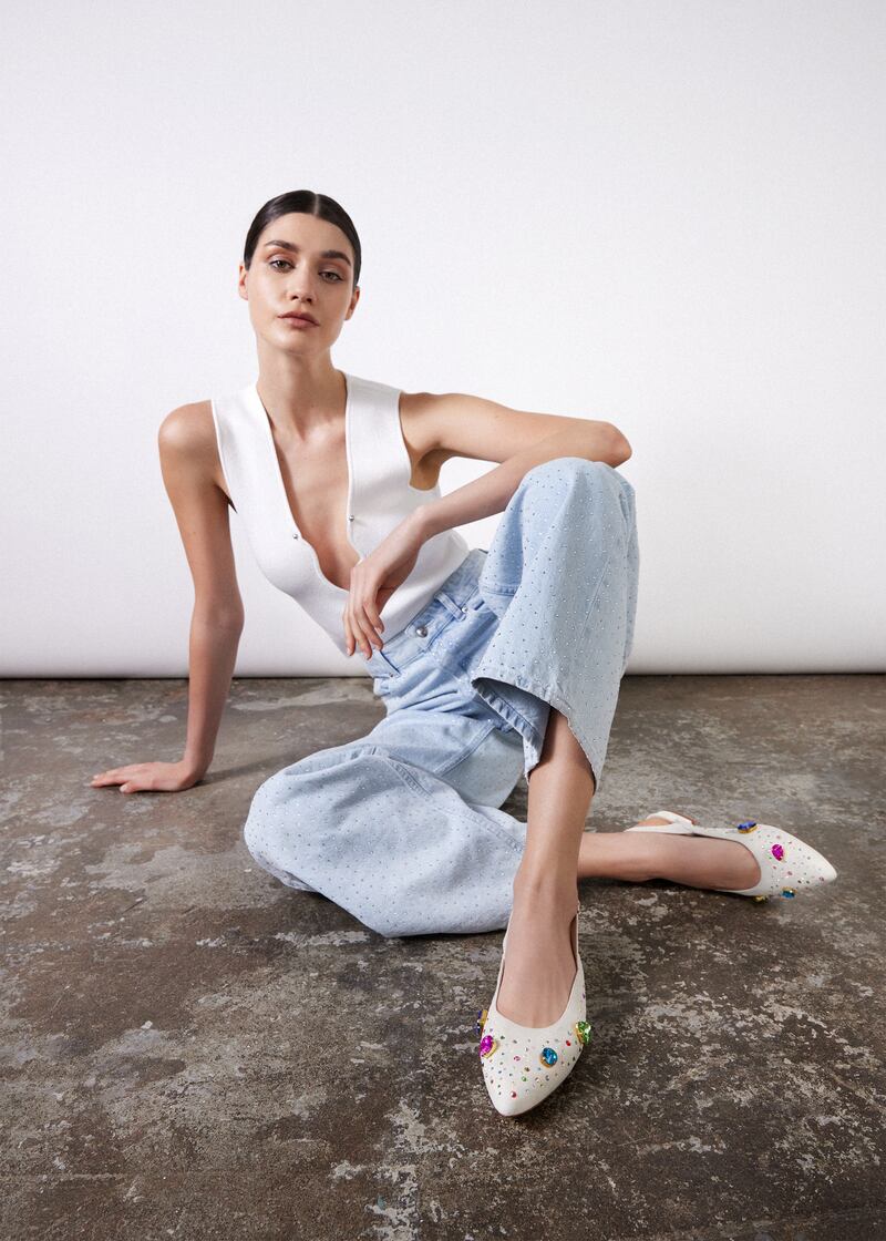 H& M whitehite ribbed low cut tee €29.99, crystal stud embellished jeans €69.99. Ivory suede flat slingbacks priced at €270 from Nicki Hoyne