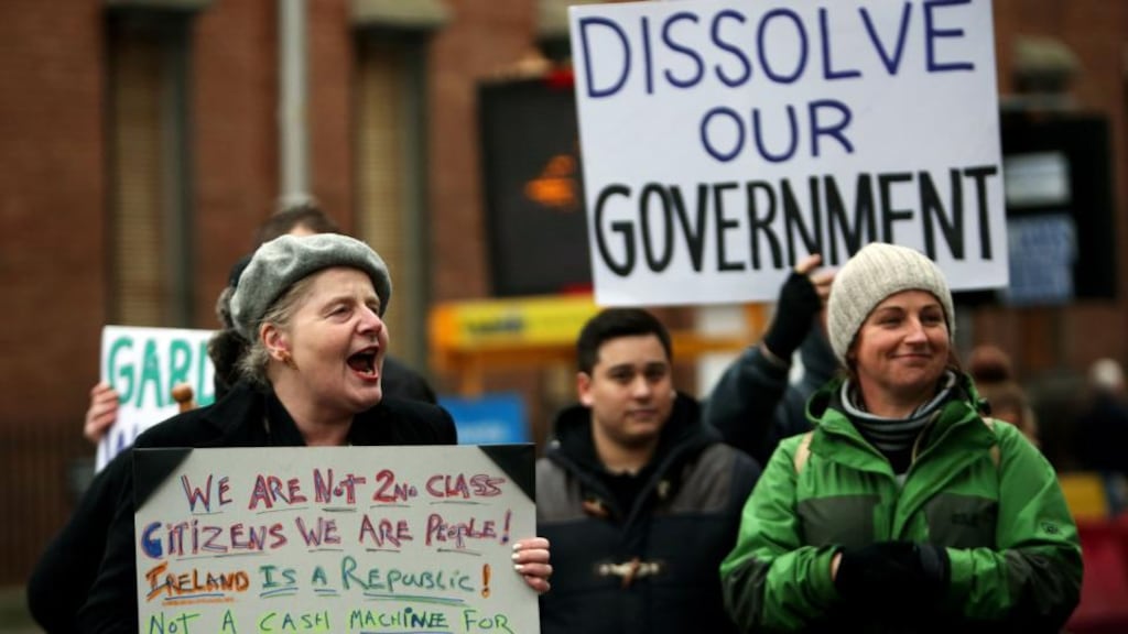 Water charge protestors outside Leinster House in Dublin yesterday. Photovgraph: PA