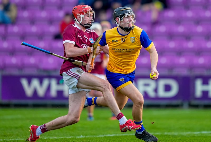 Sean Currie of Na Fianna on his way to scoring a goal is tackled by Diarmuid O'Leary of St Martin's. Photograph: James Lawlor/Inpho