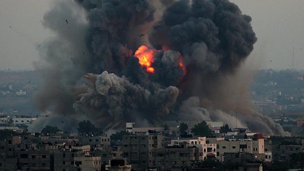 Smoke rises after an Israeli airstrike on the south of Gaza City on  June 8th, 2014. A UN report accuses both Israel and Gaza of committing war crimes during the 2014 conflict. Photograph: Mohammed Saber/EPA.