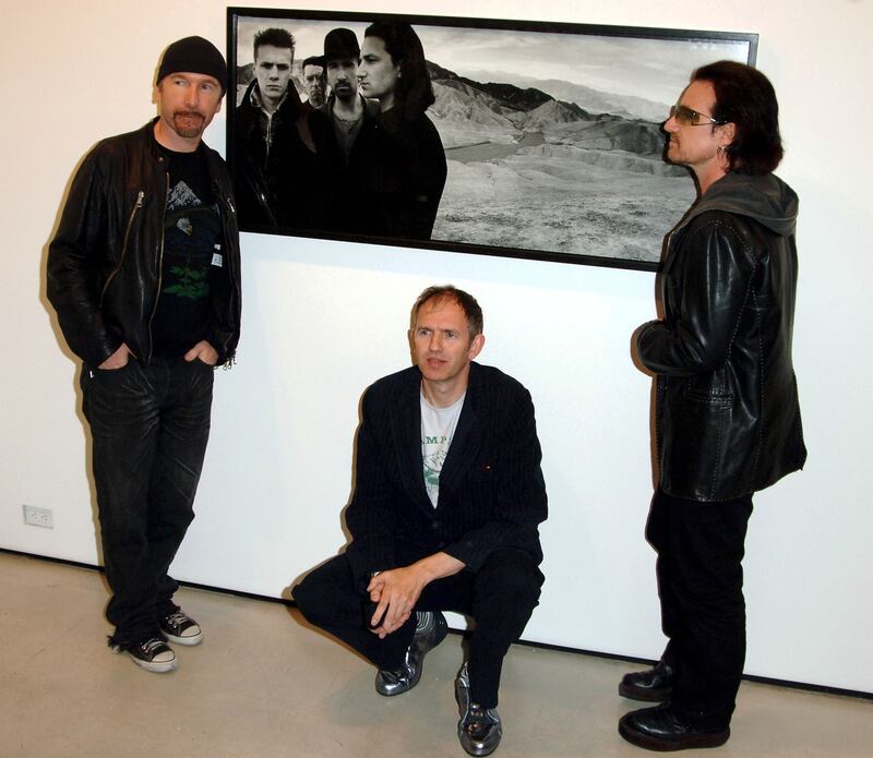 The Edge, Anton Corbijn and Bono at Corbijn's U2 & I exhibit in New York, 2005. Photograph: Brian Zak/Gamma-Rapho via Getty Images