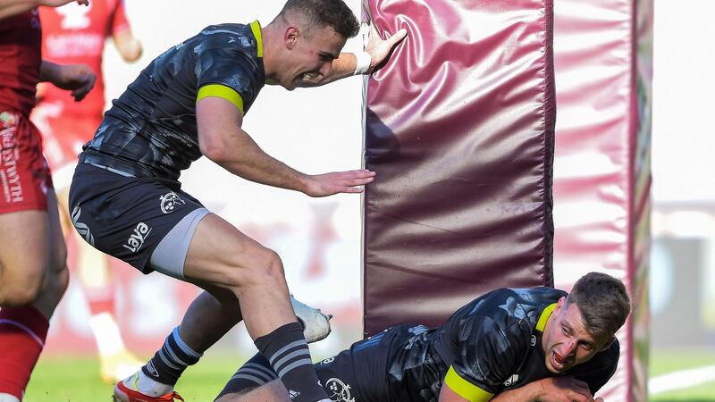 Munster’s Liam Coombes celebrates after scoring his side’s fifth try of the game with Shane Daly. Photograph: Ryan Hiscott/Inpho
