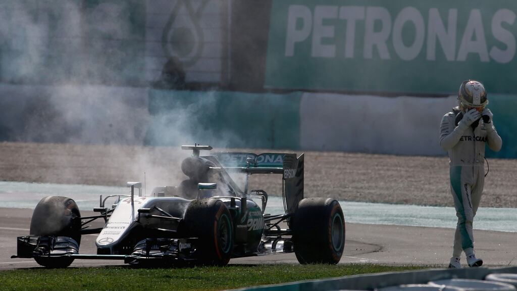 Lewis Hamilton’s world championship hopes took a major blow after his Malaysian Grand Prix was ended when his Mercedes caught fire. Photograph: Gettys)