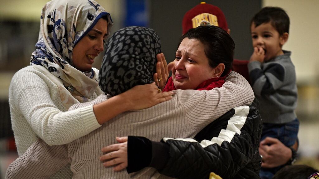 An Iraqi family from Woodbridge, Virginia, welcomes their grandmother at Dulles International Airport in Sterling, Virginia, against the backdrop of a simmering travel ban. Photograph: Astrid Riecken