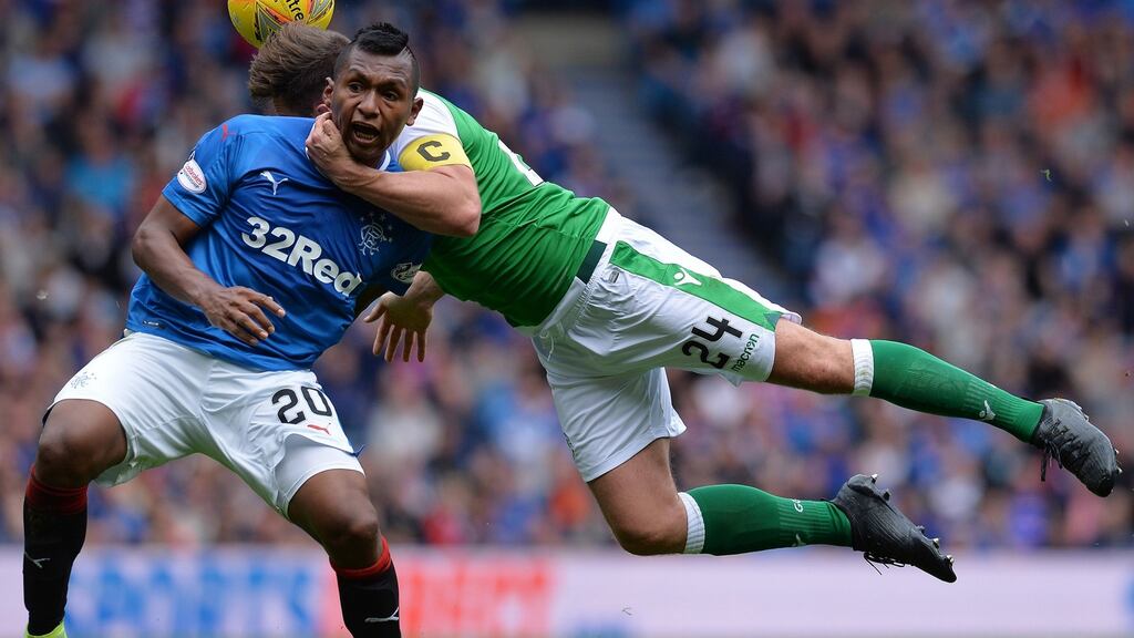 Alfredo Morelos of Rangers is hauled down by Darren McGregor of Hibernian at Ibrox. Photo: Mark Runnacles/Getty Images