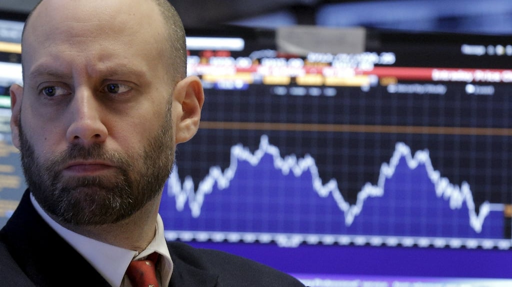 A specialist trader works at his post on the floor of the New York Stock Exchange. Photograph: REUTERS/Brendan McDermid