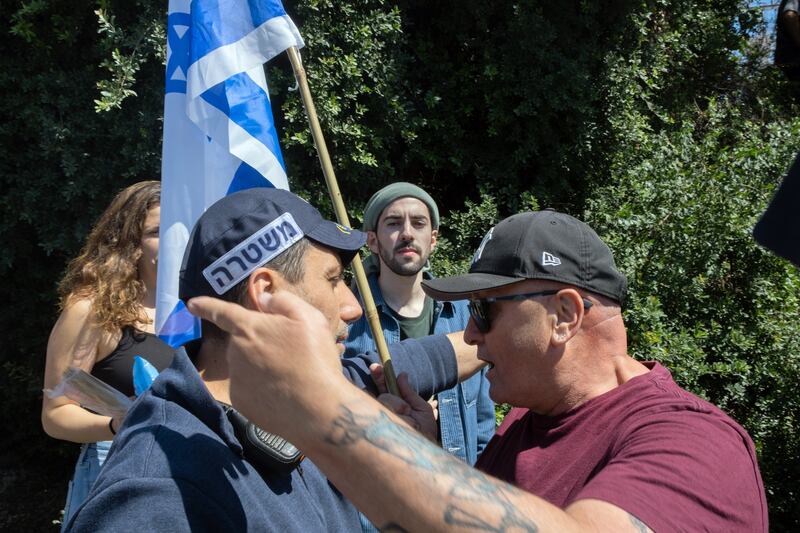 A protester arguing with a police officer during an attempt to block a highway in Tel Aviv. Photograph: Amit Elkayam/The New York Times