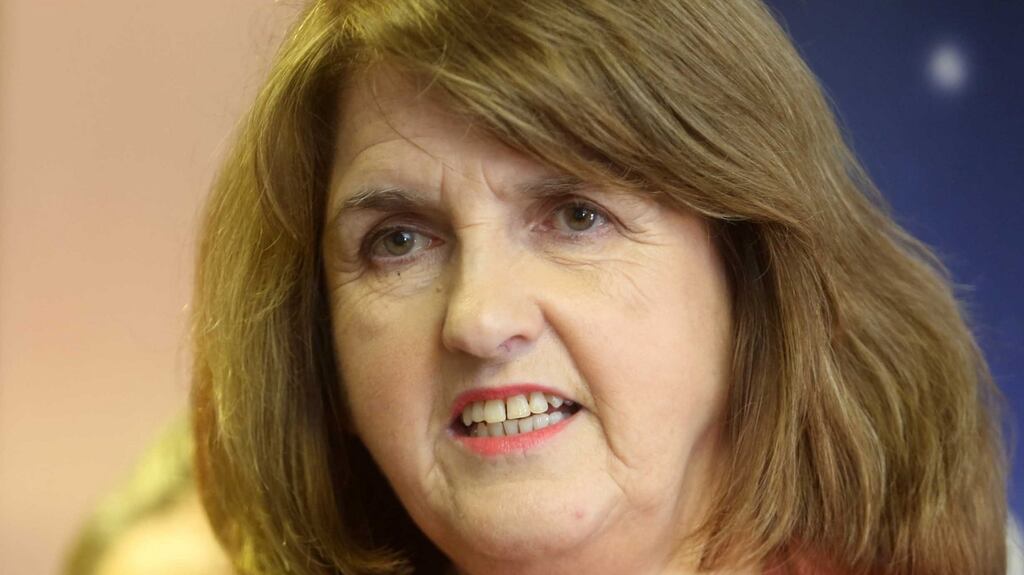 Tánaiste Joan Burton: says the Labour Party will commit itself to split all available future resources between spending increases and tax cuts on a three-to-one basis in favour of spending. Photograph: Sam Boal