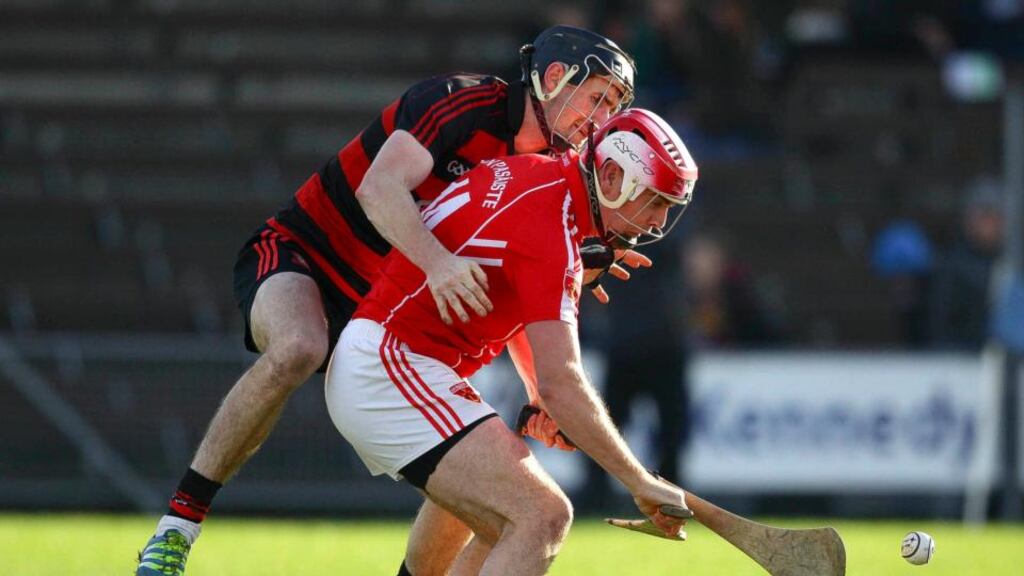 Ballygunner’s Barry Coughlan in action against Passage’s Eoin Kelly during the Waterford Senior Hurling Championship Final. Photo: Inpho