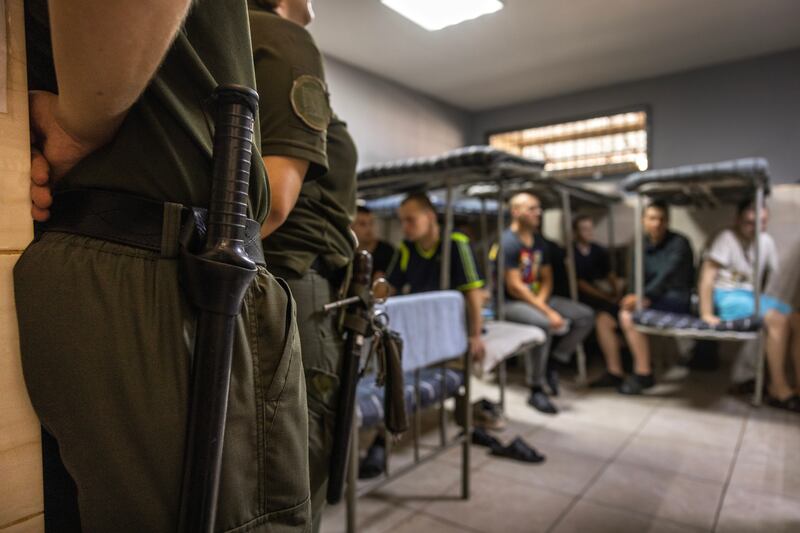Russian prisoners of war in bunk beds inside a Ukrainian prison cell in northern Ukraine. Photograph: David Guttenfelder/The New York Times