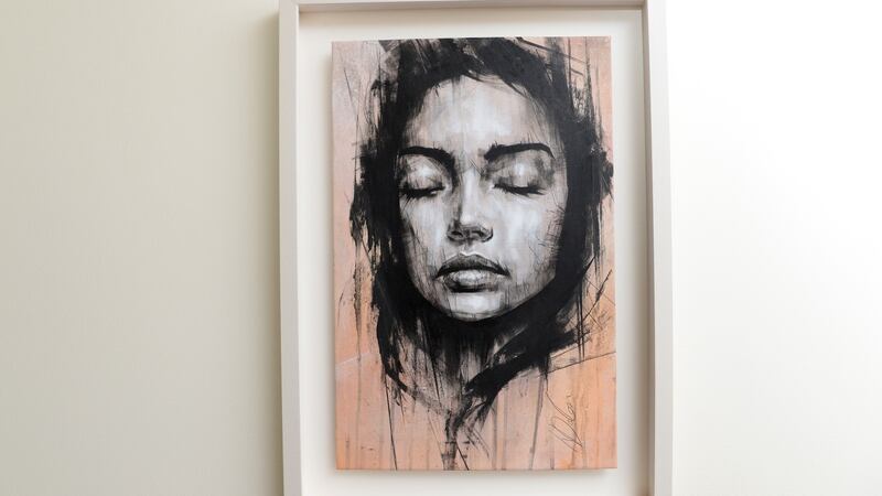 A portrait of a woman on the stairway of Karen Koster’s home. Photograph: Cyril Byrne