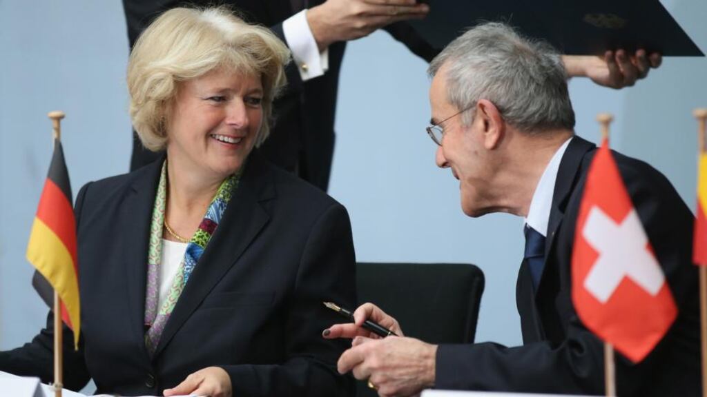 Christoph Schaeublin, president of the Foundation Council of the Kunstmuseum Bern art museum, and Monika Gruetters, German state culture minister, sign an agreement over the future of the Gurlitt Collection. Photograph: Sean Gallup/Getty Images