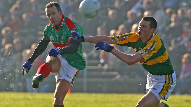 David Brady gets the ball away under pressure from Kieran Donaghy during a 2007 League match. Photograph: Lorraine O’Sullivan/Inpho