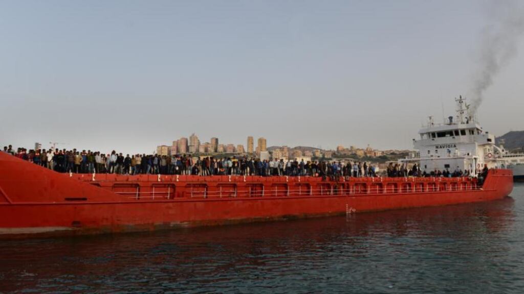 Safe landing: Migrants arriving at Porto Empedocle in Sicily after being rescued 40km off the Libyan coast by a Dutch freighter, the Dinteldijk. Photograph: Frank Miller