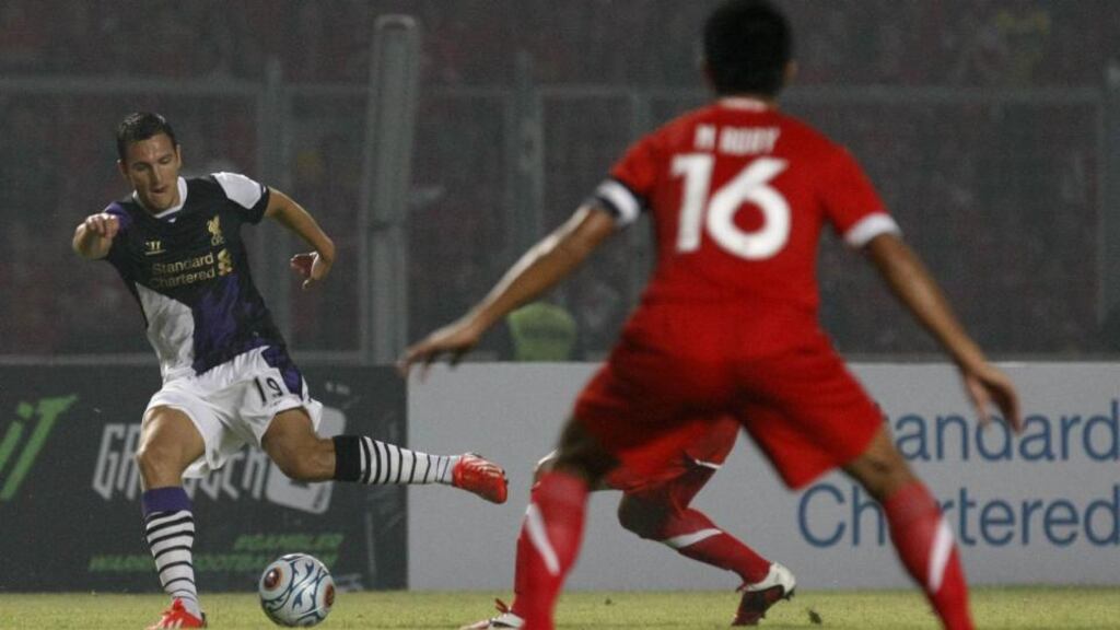 Stewart Downing (left), in action for Liverpool against an Indonesia XI in Jakarta in July, could be on his way from Liverppool to Newcastle United. Photograph: Ulet Ifansasti/Getty Images