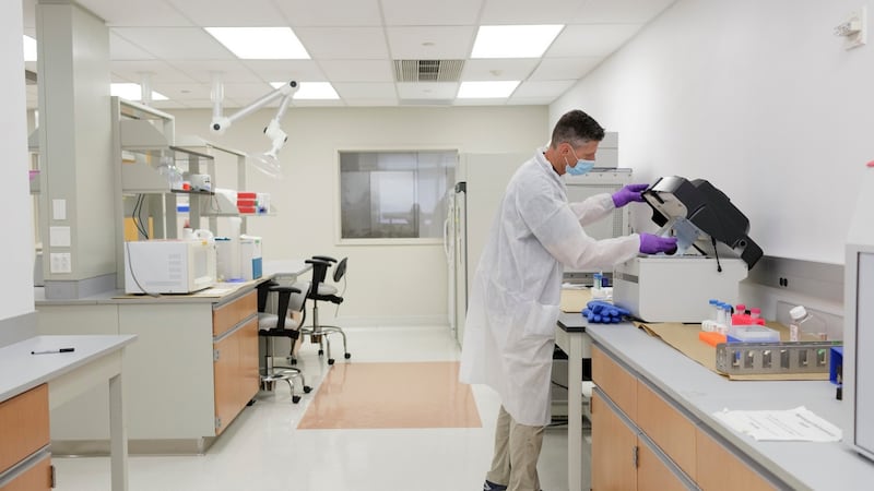 Carl Gajewski, a DNA lab supervisor, gives a demonstration on a “bone mill”, which crushes remains that can be used to extract DNA to help identify victims of the 9/11 attacks. Photograph: Anna Watts/The New York Times