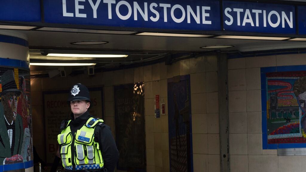 A police officer outside Leytonstone Underground station in east London. Photograph: EPA/Will Oliver