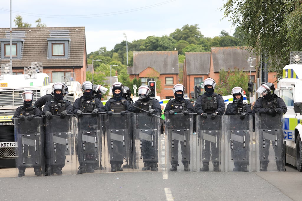 Riot police form a line on the Lower Ormeau Road, Belfast, on August 3rd this year. Photograph: Peter Morrison/PA