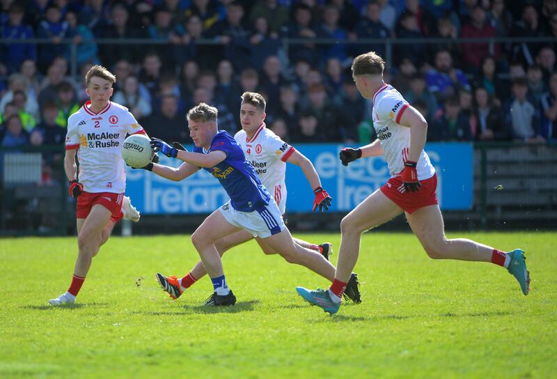 Mark Reilly of Cavan runs into Elliott Kerr, Padraig Goodman and Ciaran McCrystal of Tyrone.
Photograph: Andrew Paton/Inpho