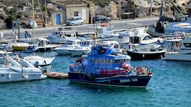 Girl (2) dies and eight others missing after boat sinks off Lampedusa in Italy