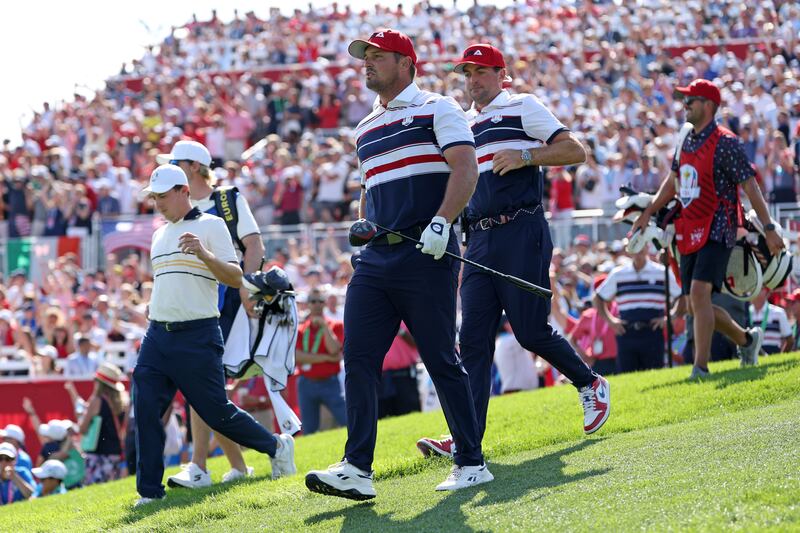 Europe's Matt Fitzpatrick (left), US captain Keegan Bradley and Bryson DeChambeau (front centre) walk off the first tee during Sunday's singles matches. Photograph: Richard Heathcote/Getty Images