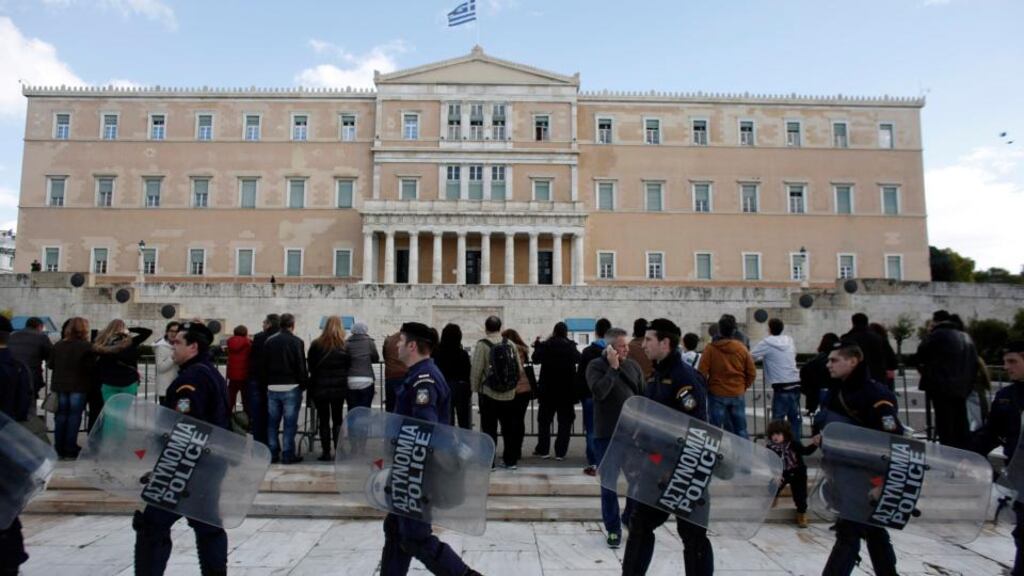 Riot police outside the parliament following a final vote by lawmakers for a new Greek president in Athens, Greece. Photographer: Kostas Tsironis/Bloomberg