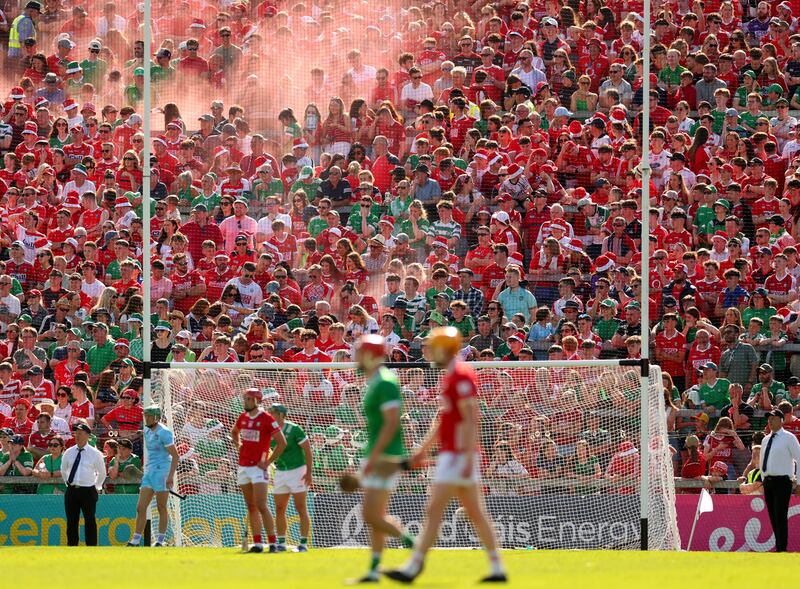 Flares in the crowd at the Limerick and Cork game. Photograph: James Crombie/Inpho