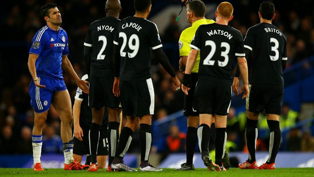 Diego Costa receives his fifth yellow card of the season against Watford. Photograph: Richard Heathcote/Getty Images