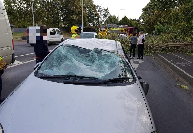 Cars were damaged by fallen trees at Stillorgan. Photograph: Dublin Fire Brigade/Twitter