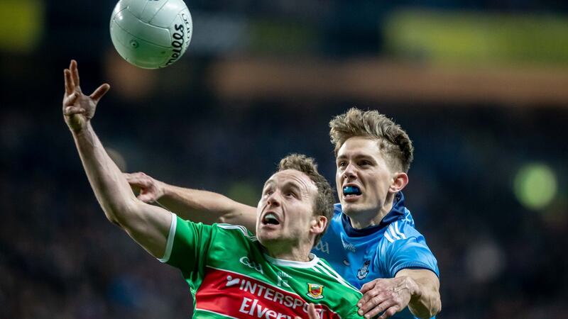 Mick Fitzsimons in action against Mayo’s Andy Moran. “I ended up in the full back line and found a niche, enjoyed it, enjoyed the analytical and technical aspects of trying to keep someone else quiet.” Photograph: Morgan Treacy/Inpho