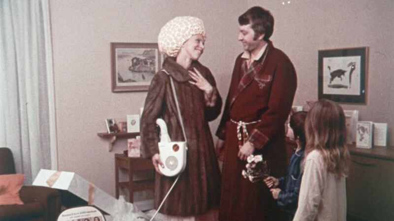 Irish Film Archive still from Ronson advertisement. It is a hair dryer but  one that comes with a shoulder strap. ‘Apart from a mink coat, what else could a girl want?’